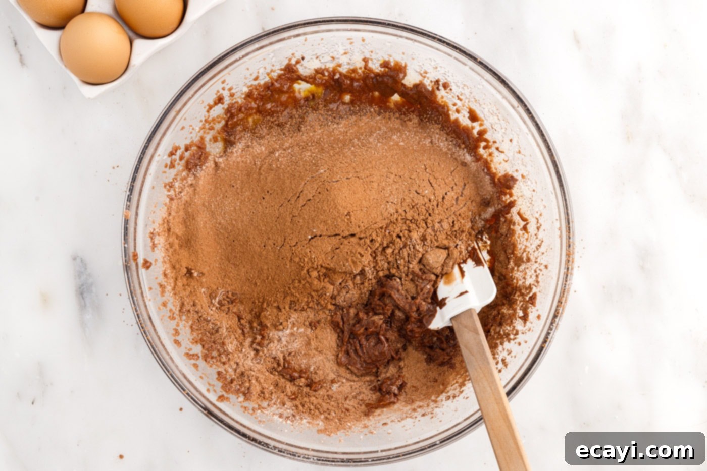 Peanut Butter Brownie Bliss 9 rubber spatula combining dry ingredients and wet ingredients for brownies