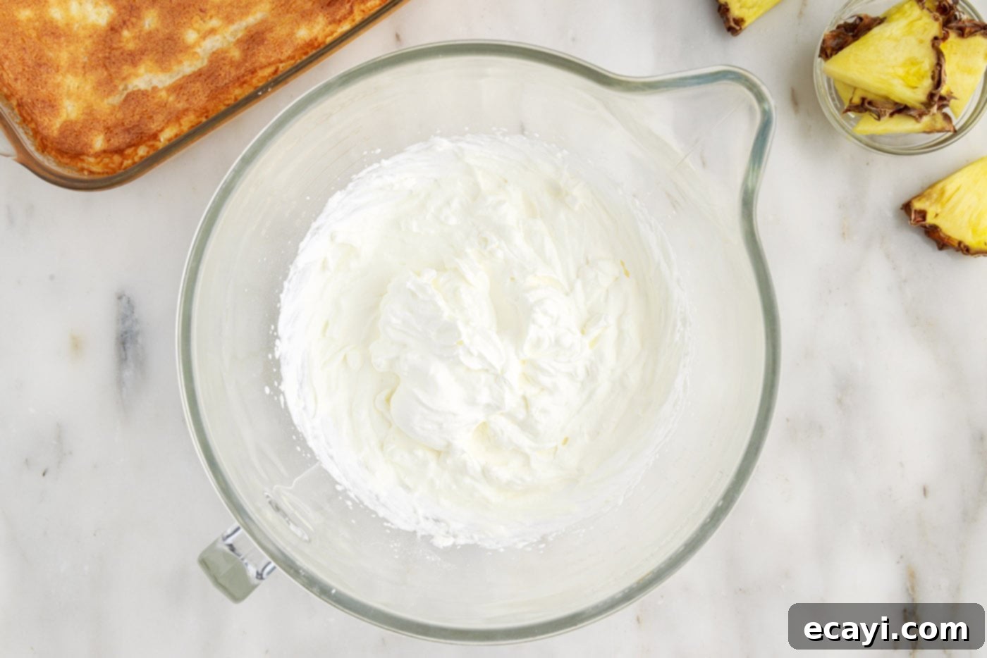 Tropical Pineapple Angel Delight 9 homemade whipped cream being whipped in a bowl