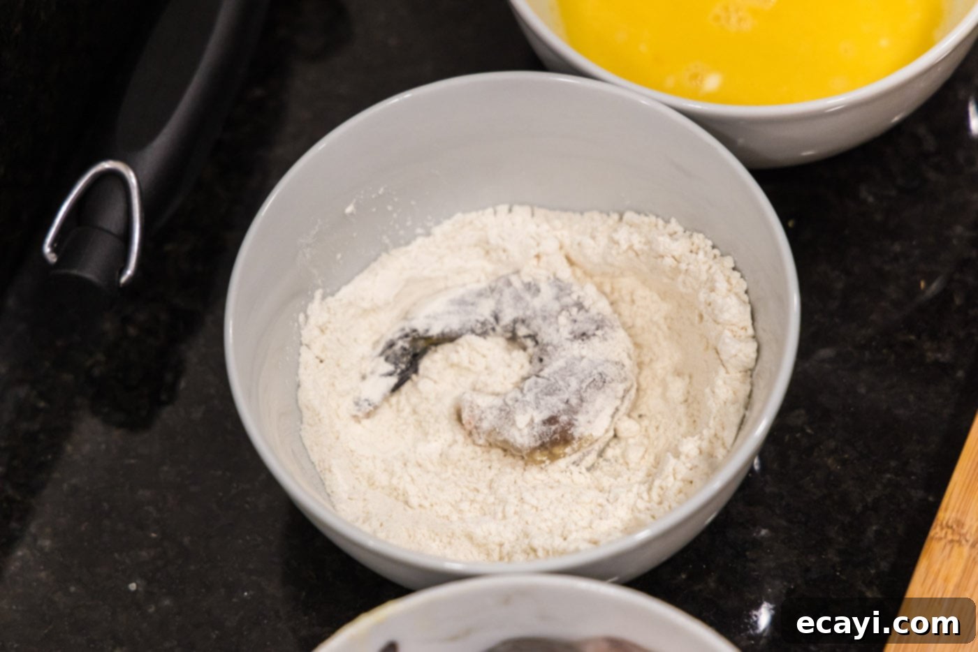 Golden Crispy Shrimp 8 shrimp in a bowl of flour