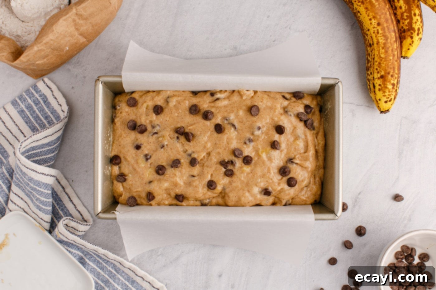 Banana Chip Indulgence 13 chocolate chip banana bread batter in a loaf pan