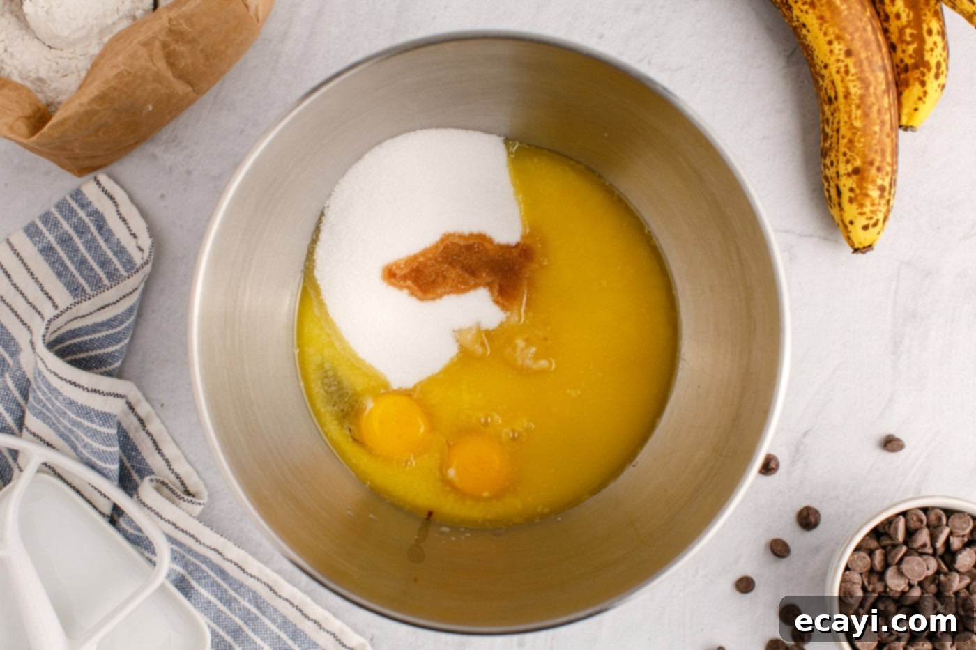 Banana Chip Indulgence 7 mashed bananas, eggs, vanilla, and sugar in a stand mixer bowl