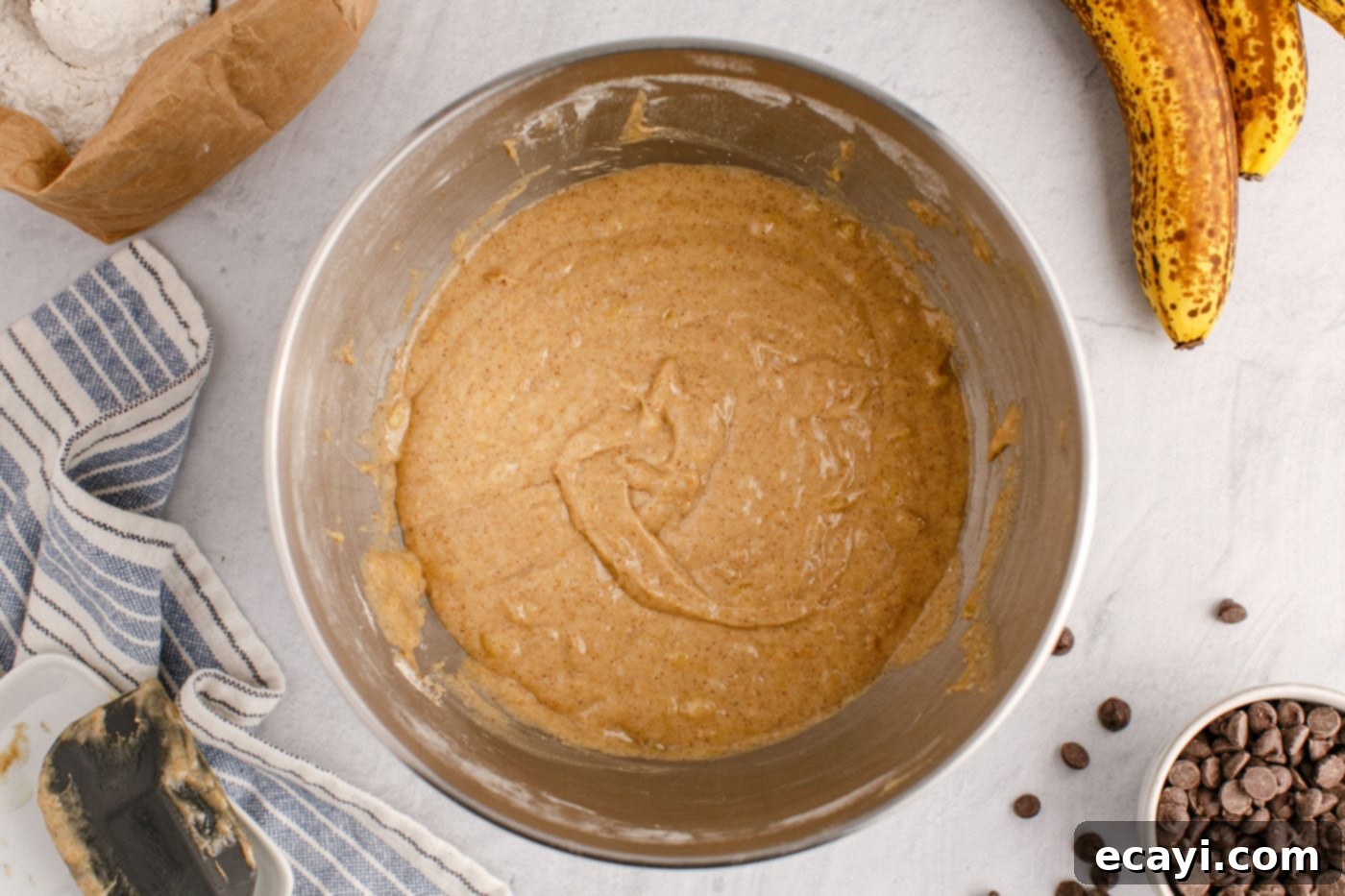 Banana Chip Indulgence 10 banana bread batter in a mixing bowl