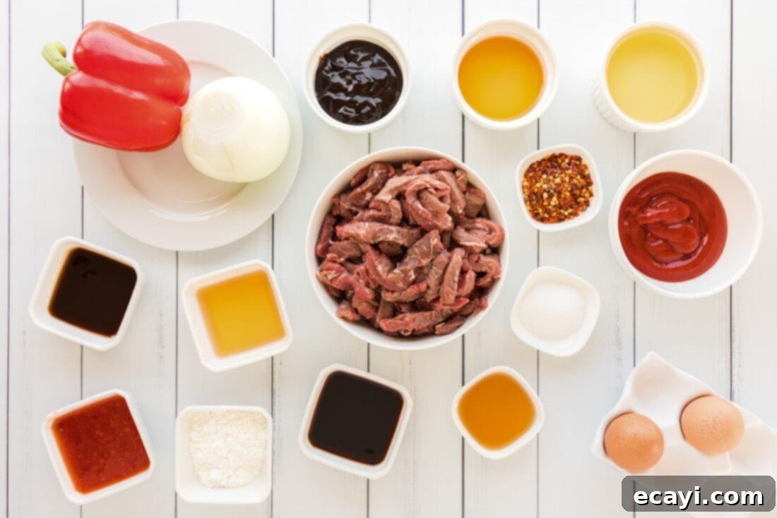 Crispy Beijing Beef 4 A flat lay photograph displaying all the fresh ingredients and sauces required to make the homemade Beijing Beef recipe.