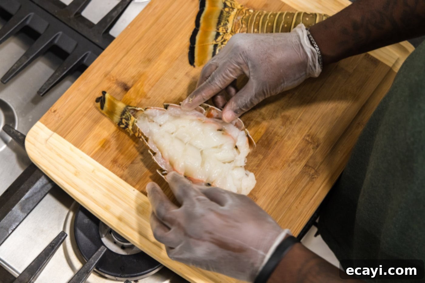 Succulent Grilled Lobster Tail 7 breaking open lobster tail to expose the meat