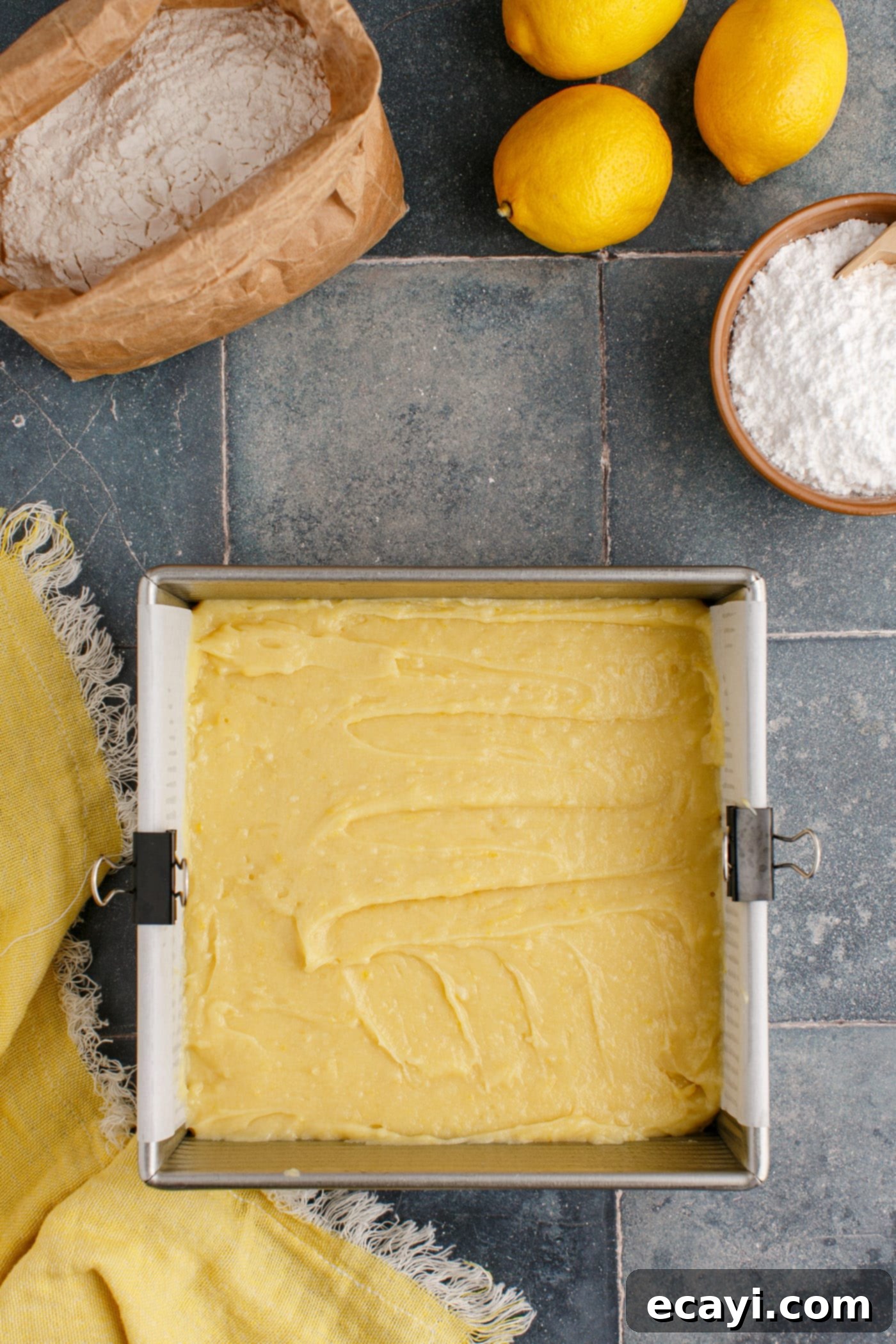 Sunshine Lemon Brownies 8 lemon brownie batter spread evenly in an 8x8 baking pan
