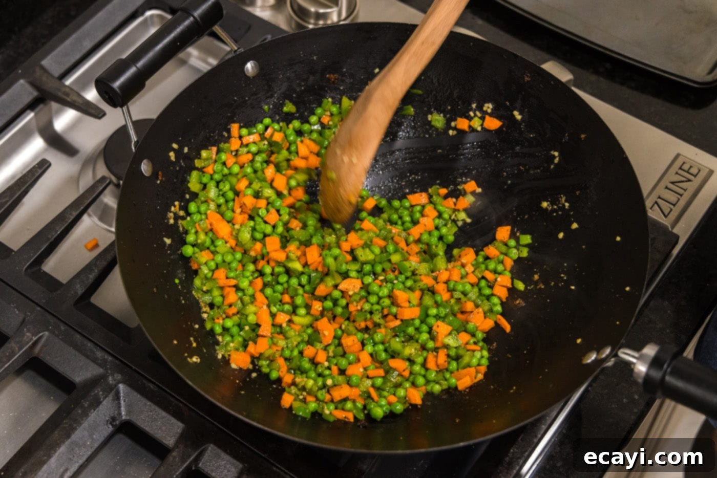 Wok-Fired Pork Fried Rice 10 Colorful diced vegetables like bell peppers, carrots, and peas being stir-fried in a wok