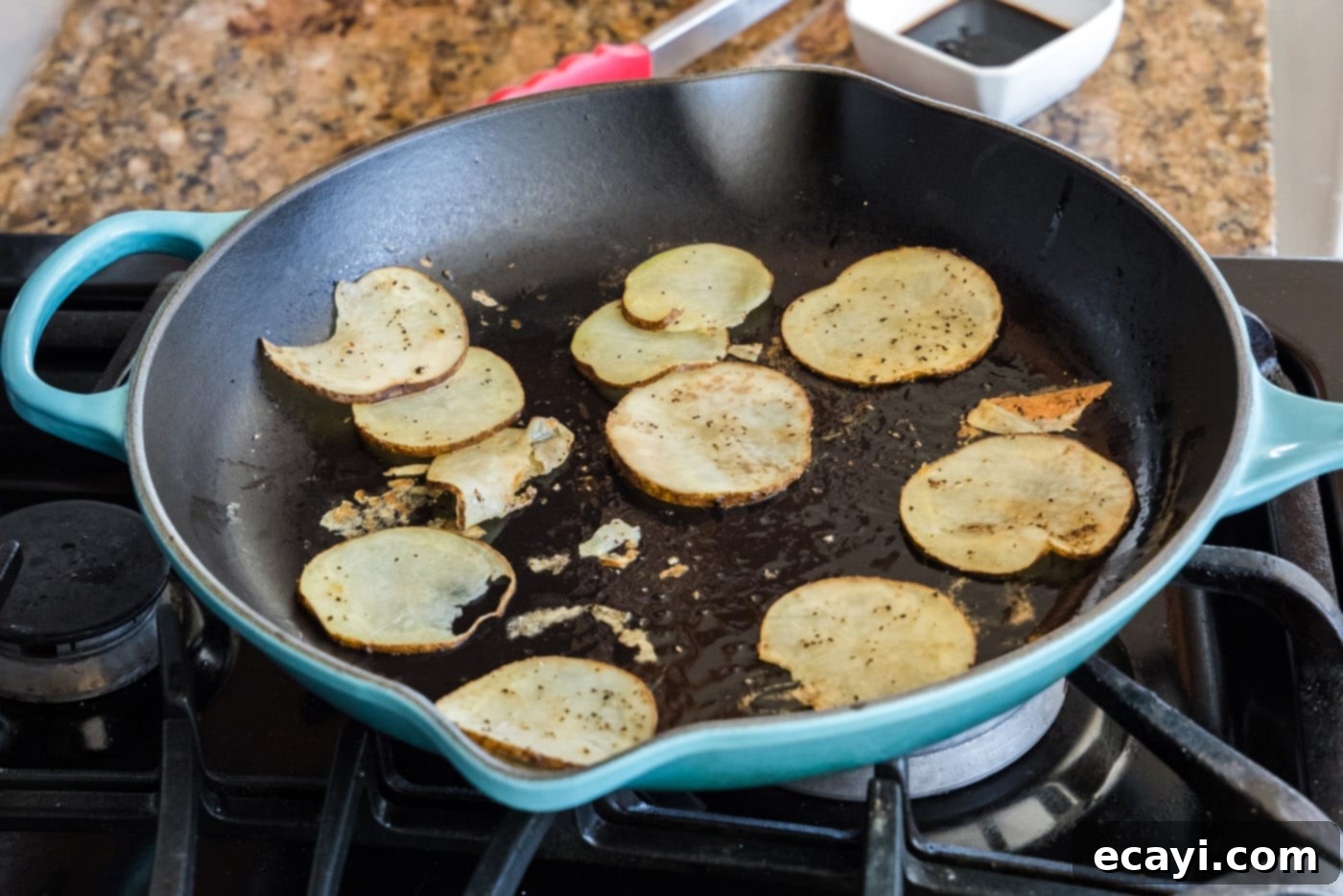 Tender Roast Beef Perfection 5 Thinly sliced Russet potatoes cooking in a hot skillet with olive oil