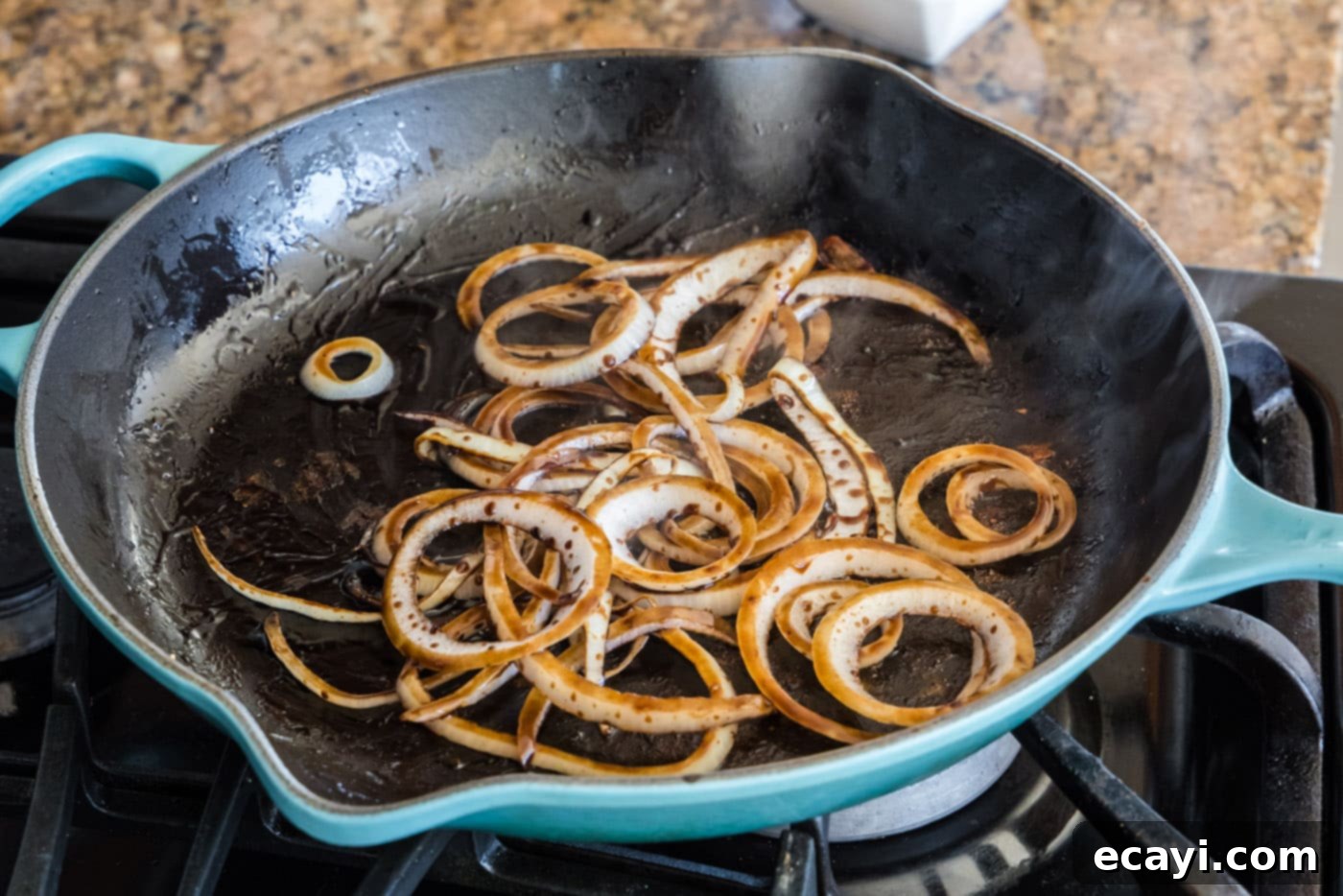 Tender Roast Beef Perfection 7 Balsamic glazed onions caramelizing in a skillet, turning golden brown