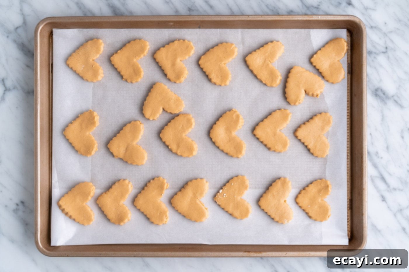Decadent Chocolate Peanut Butter Hearts 11 heart shaped peanut butter bars on a baking sheet