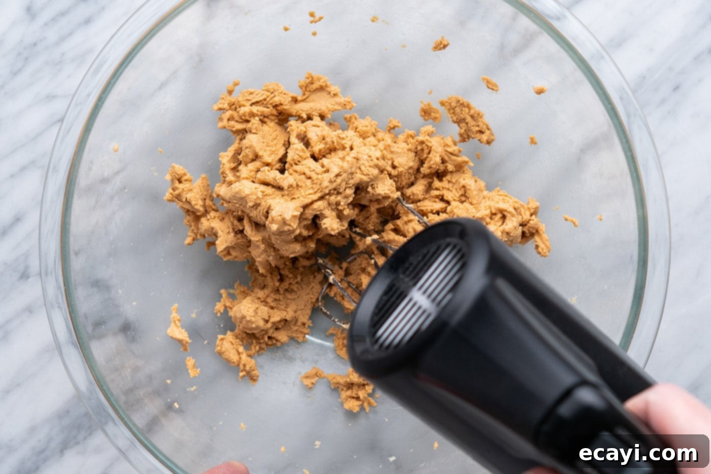 Decadent Chocolate Peanut Butter Hearts 6 Electric mixer combining peanut butter and powdered sugar