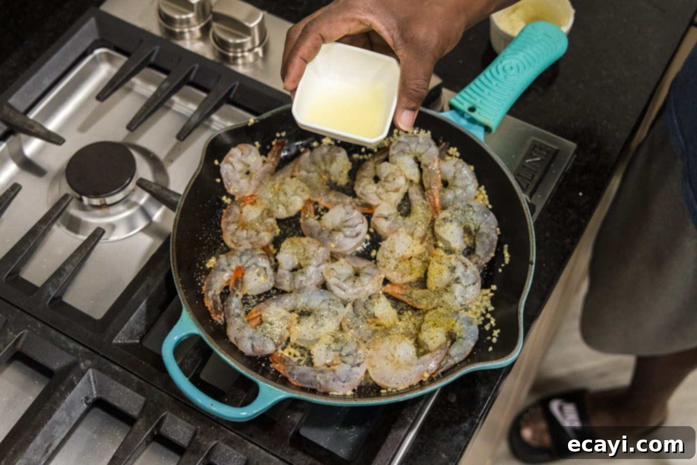 Sizzling Garlic Butter Shrimp 11 Pouring fresh lemon juice into the skillet with seasoned shrimp and butter