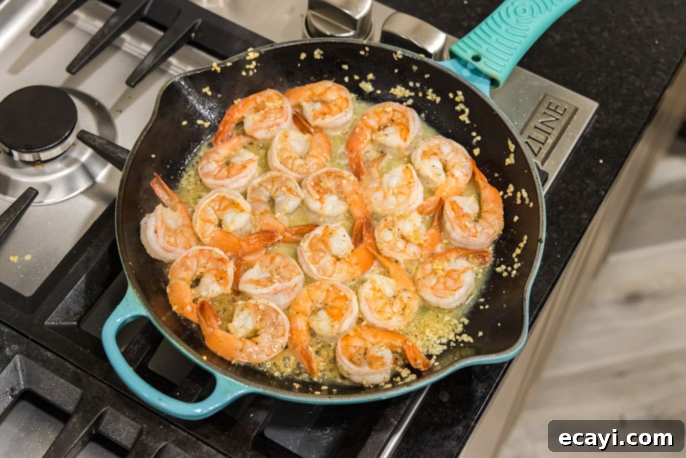 Sizzling Garlic Butter Shrimp 13 Close up of perfectly cooked, golden lemon garlic butter shrimp in a skillet, ready to serve