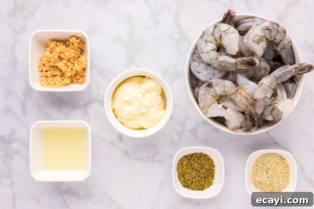 Sizzling Garlic Butter Shrimp 4 Lay out of fresh ingredients for Garlic Butter Shrimp including raw shrimp, lemons, butter sticks, and spices
