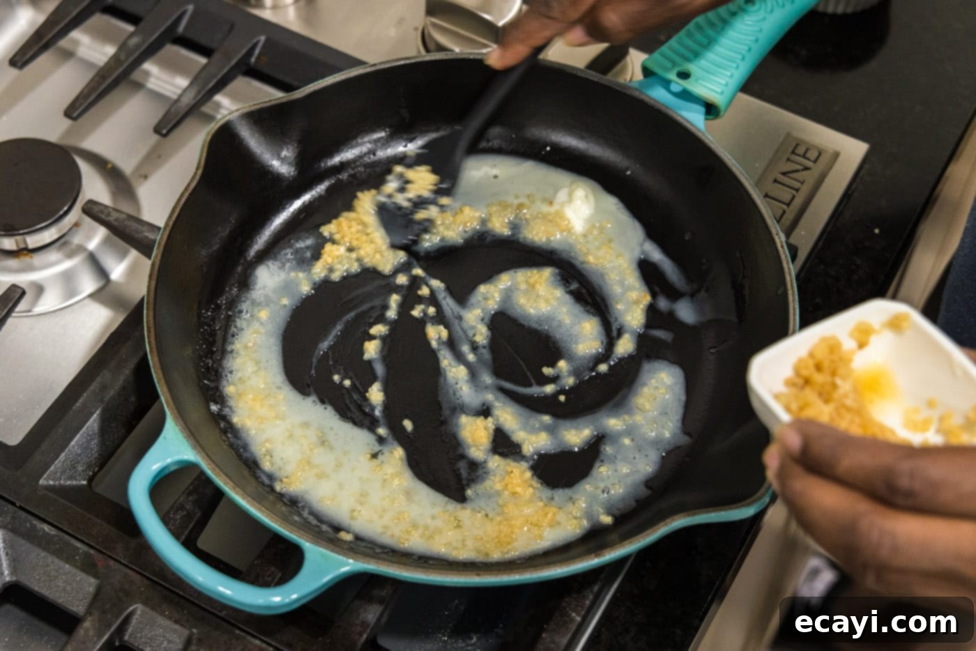 Sizzling Garlic Butter Shrimp 7 Melted butter in a skillet with minced garlic simmering