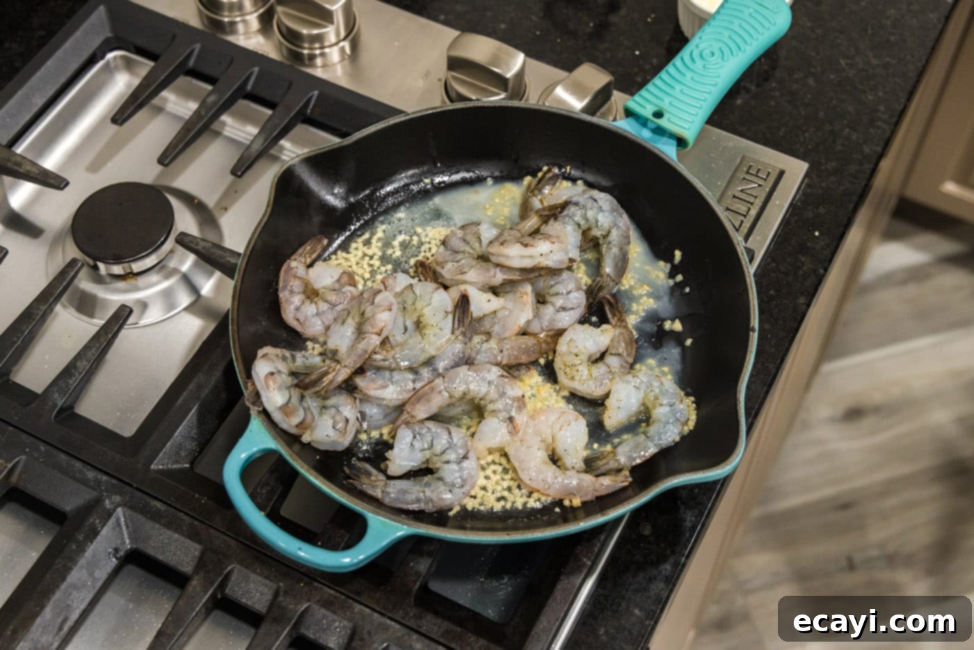 Sizzling Garlic Butter Shrimp 8 Seasoned shrimp arranged in a single layer in a hot skillet with butter and garlic