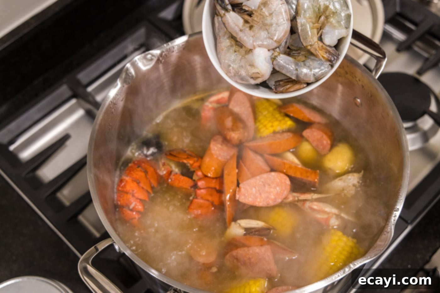 Ocean's Harvest Party 11 adding shrimp to pot with seafood boil