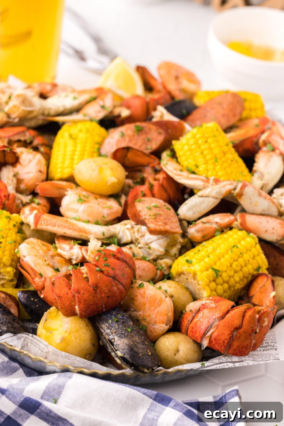 Ocean's Harvest Party 3 Seafood Boil generously spread on a metal serving platter