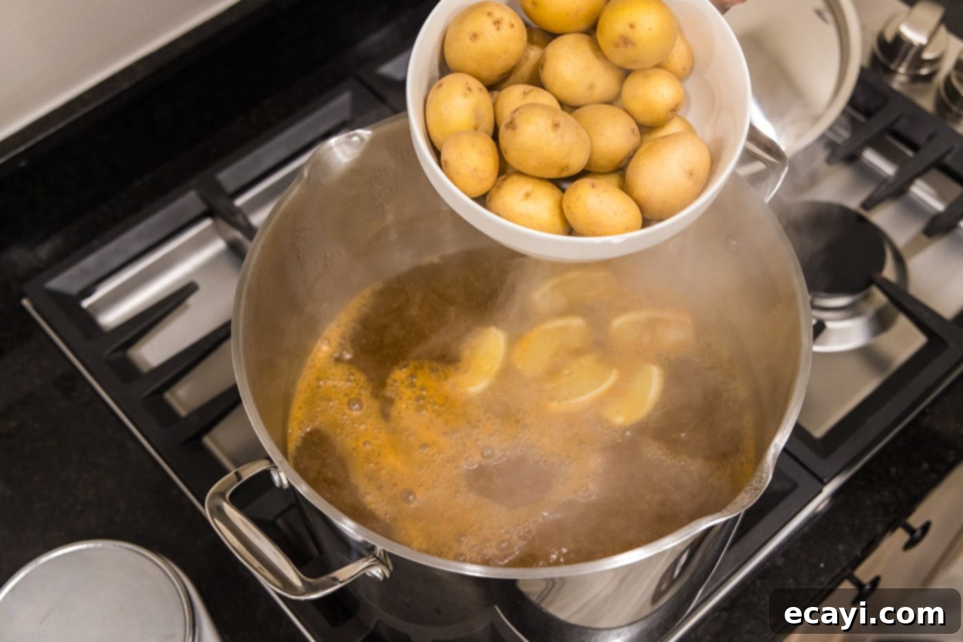 Ocean's Harvest Party 6 adding yukon gold babay potatoes to a pot of boiling water