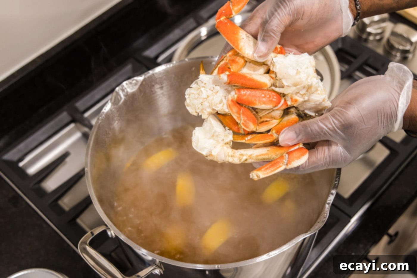 Ocean's Harvest Party 7 adding dungeness crab legs to seafood boil