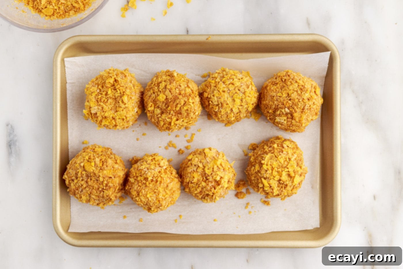 Crispy-Coated Cream Dream 13 fried ice cream balls on a baking sheet