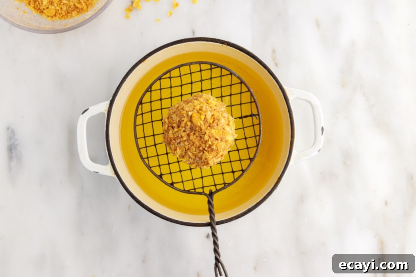 Crispy-Coated Cream Dream 14 dipping cornflake coated ice cream into oil