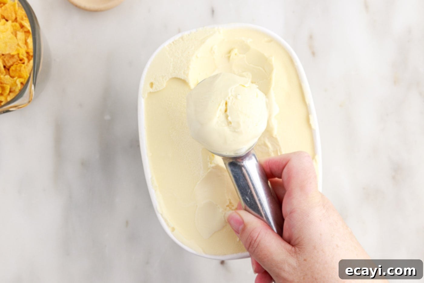 Crispy-Coated Cream Dream 5 hand rolling ice cream with a scoop