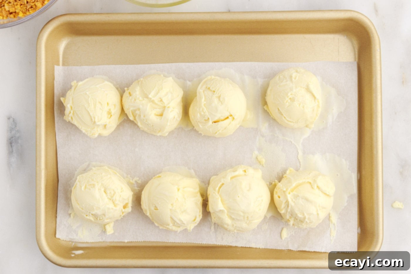 Crispy-Coated Cream Dream 6 ice cream balls on parchment lined baking sheet