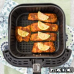 Easy Crispy Air Fryer Salmon 10 Air Fryer Salmon in an air fryer basket, showing a perfectly cooked filet