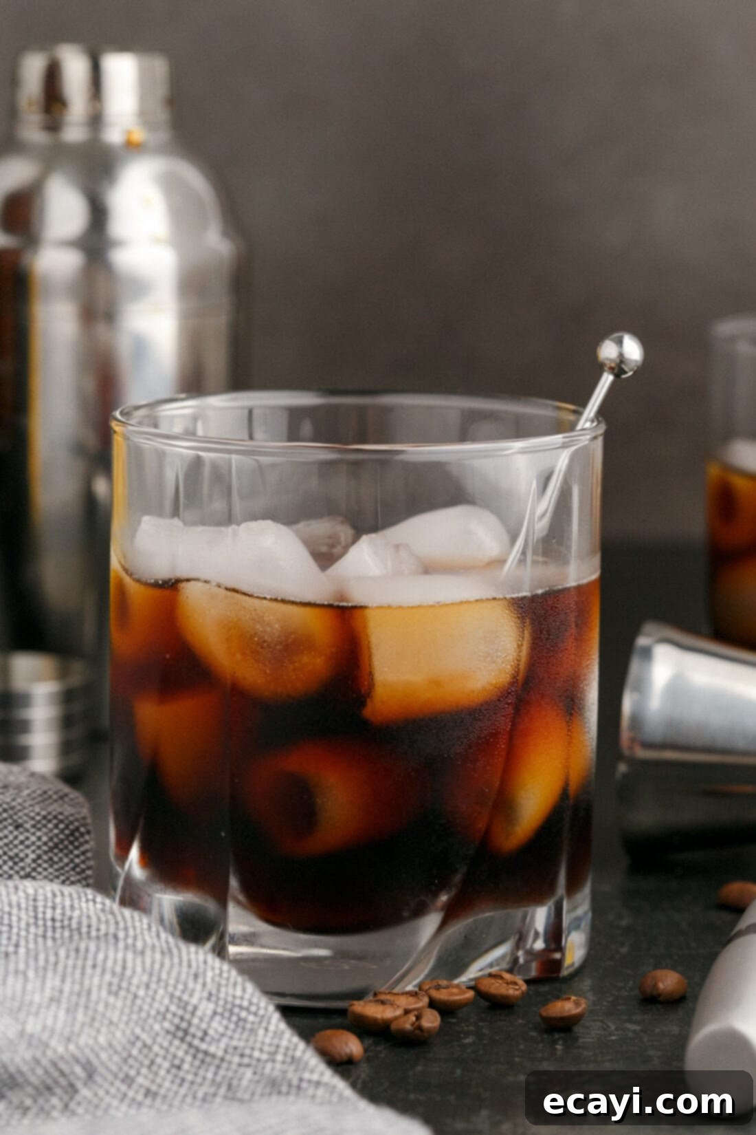 Siberian Night 3 Black Russian with a cocktail shaker in the background, ready for mixing