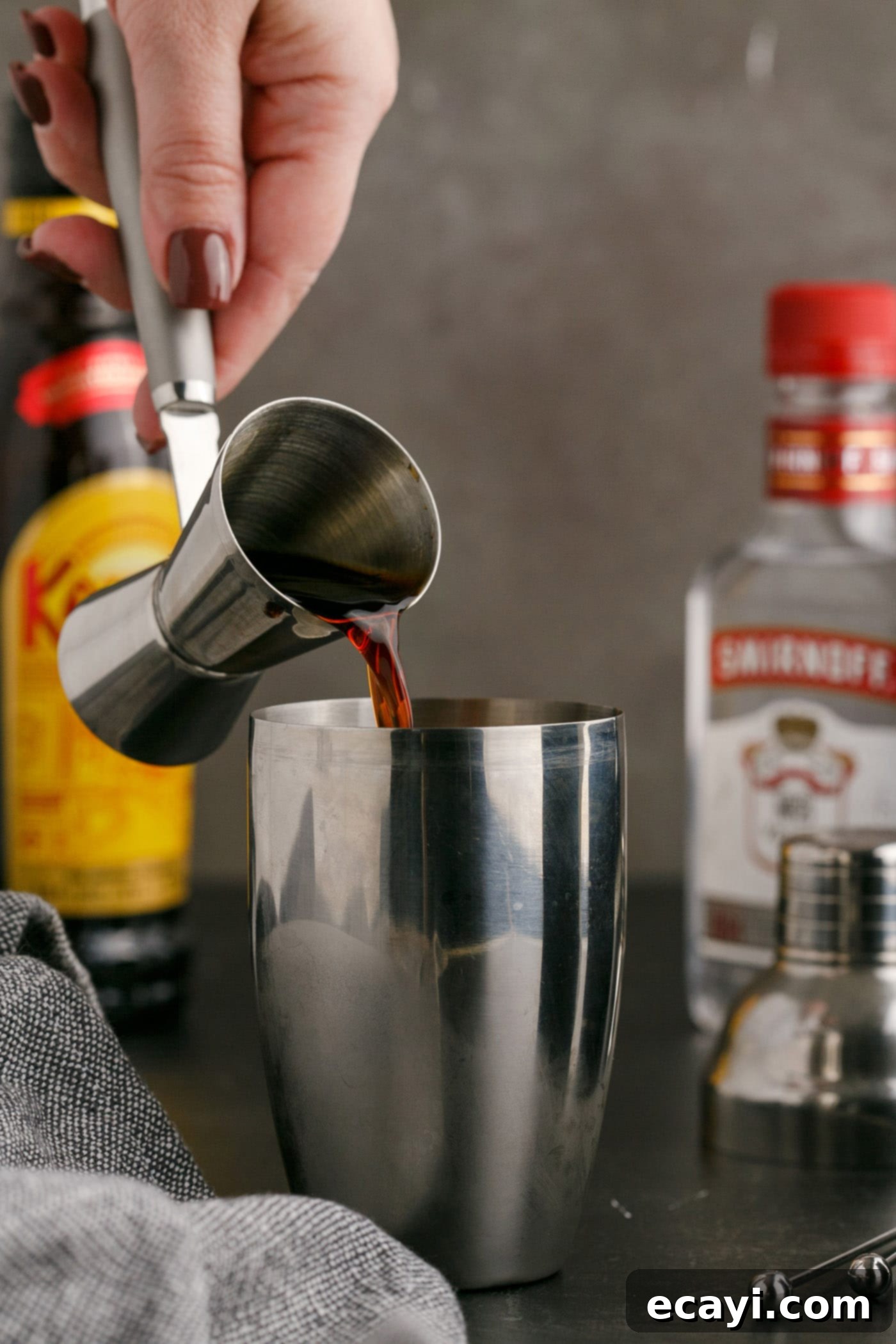 Siberian Night 5 pouring Kahlua into cocktail shaker