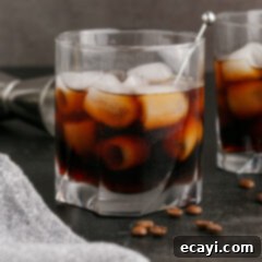 Siberian Night 9 Black Russian in a rocks glass with another Black Russian behind it, showcasing the rich color