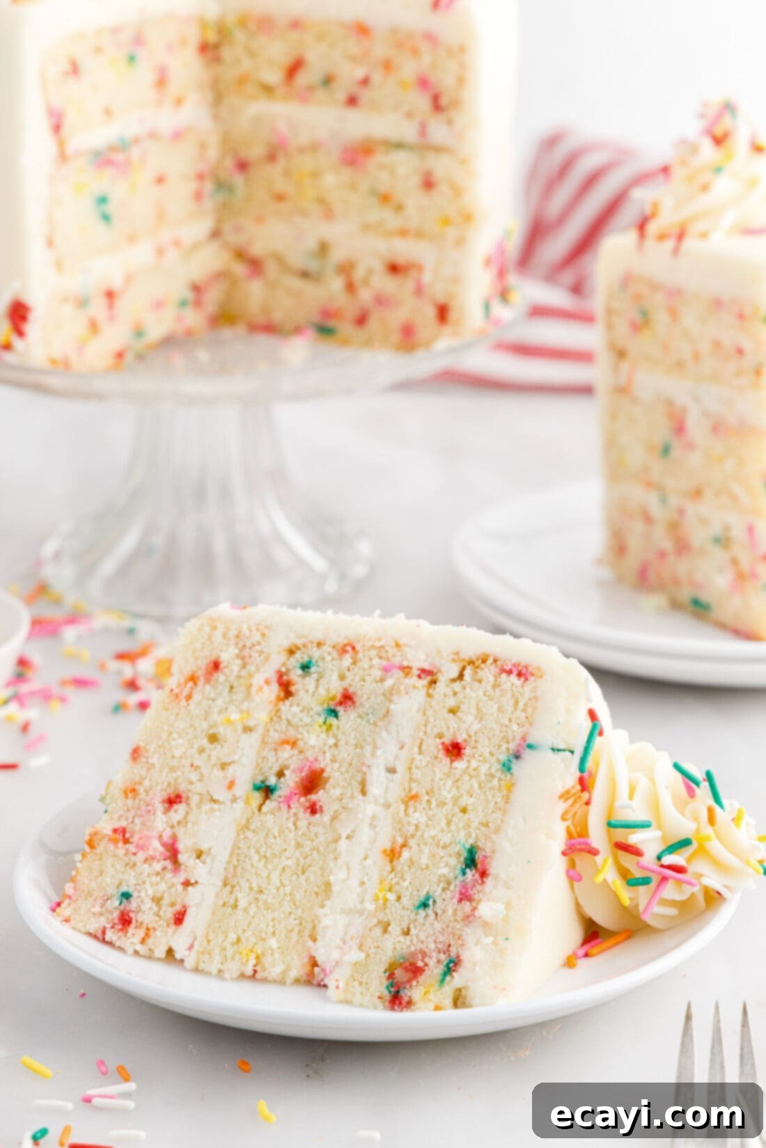 Classic Funfetti Cake 3 Slice of Funfetti Cake on a plate