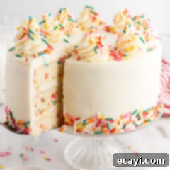 Classic Funfetti Cake 6 Funfetti Cake with a slice being removed