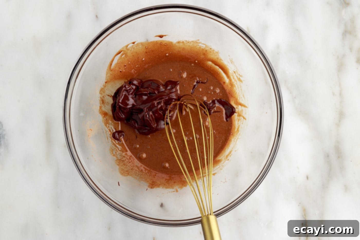 Molten Chocolate Bliss 11 whisking batter and chocolate mixture in a bowl