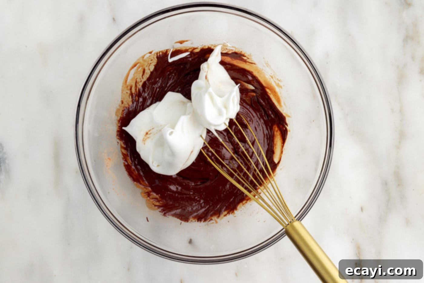 Molten Chocolate Bliss 13 combining whipped egg whites and chocolate batter with a whisk