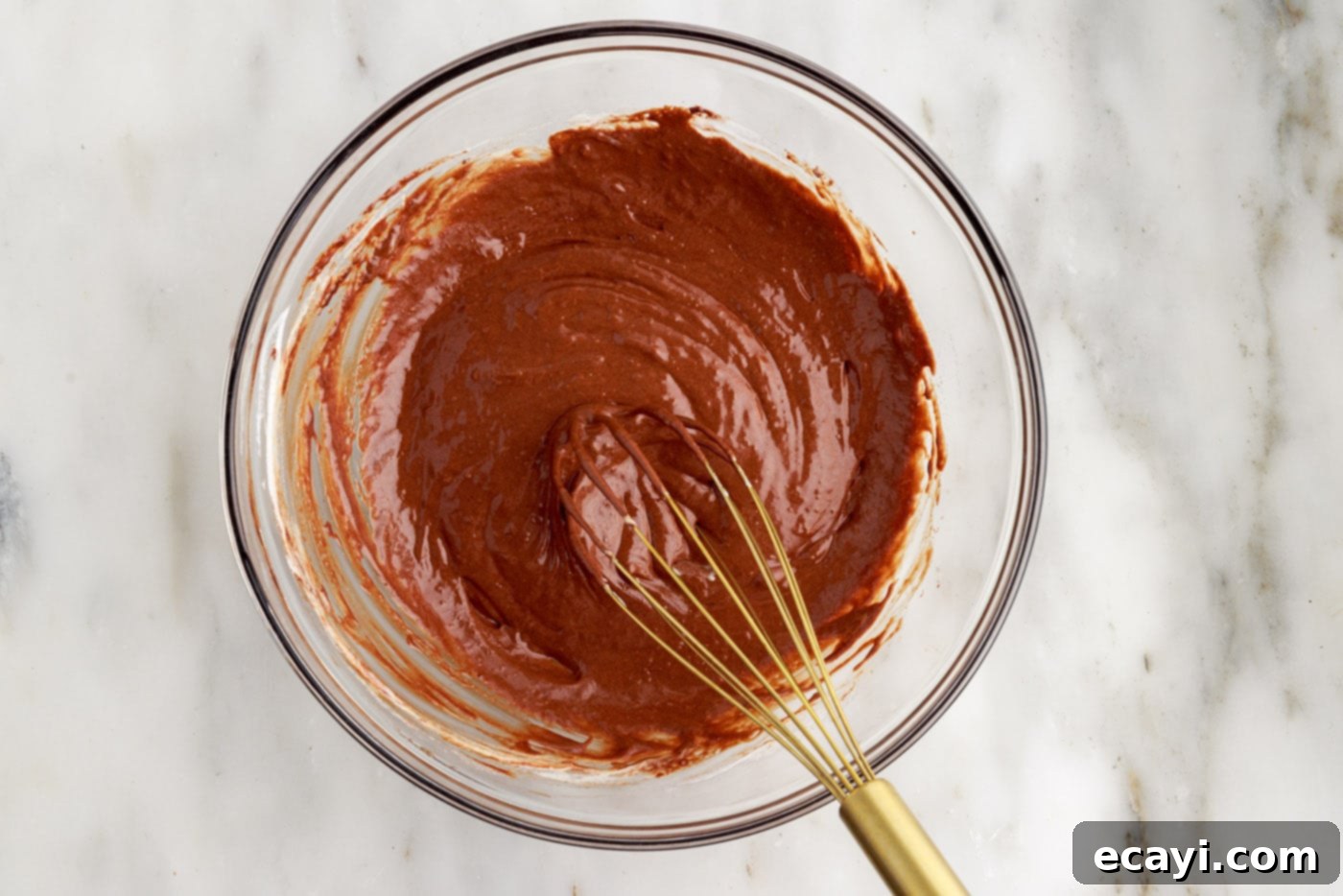 Molten Chocolate Bliss 14 molten lava cake batter in a bowl with a whisk