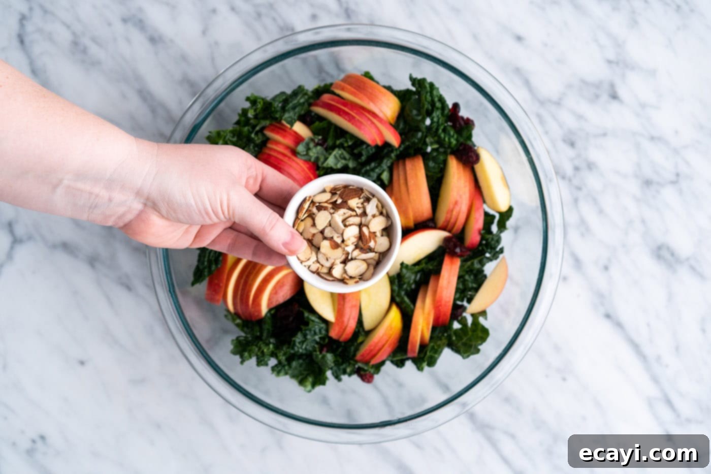 Signature Kale Salad 9 adding almonds to kale salad