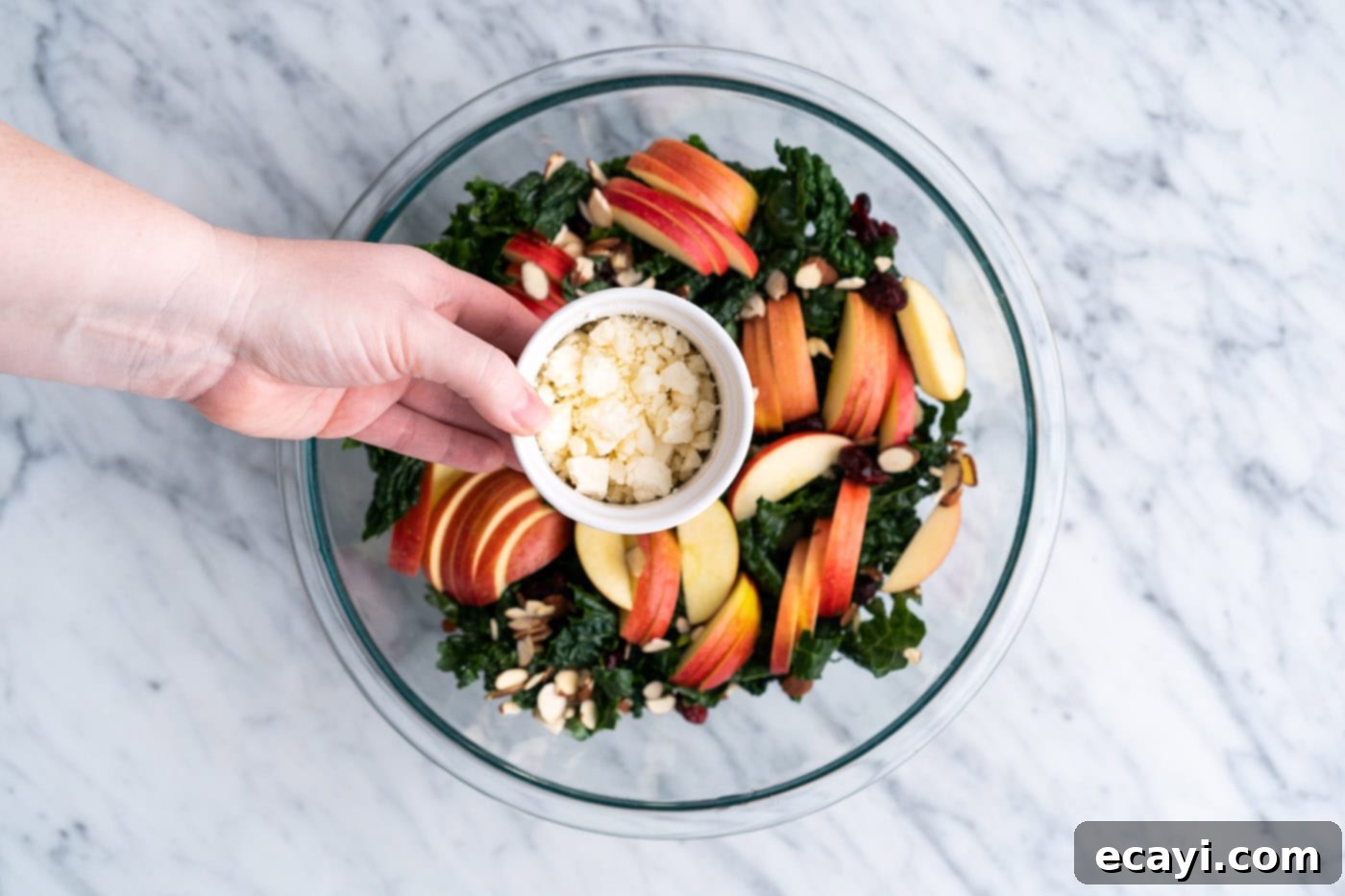 Signature Kale Salad 10 adding crumbled feta to kale salad