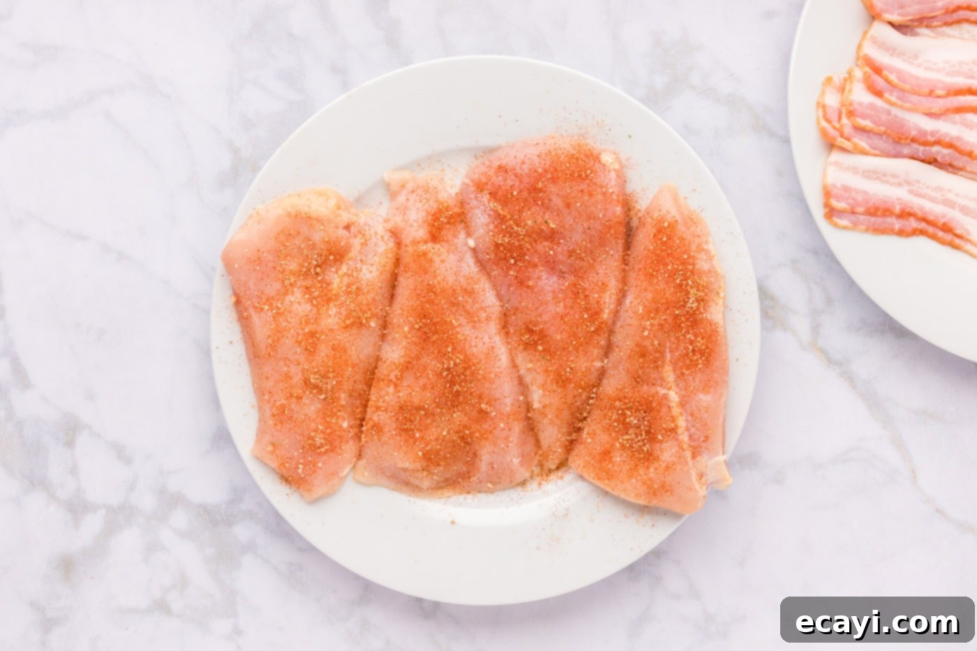 Crispy Bacon-Wrapped Chicken 6 seasoned chicken breasts on a plate