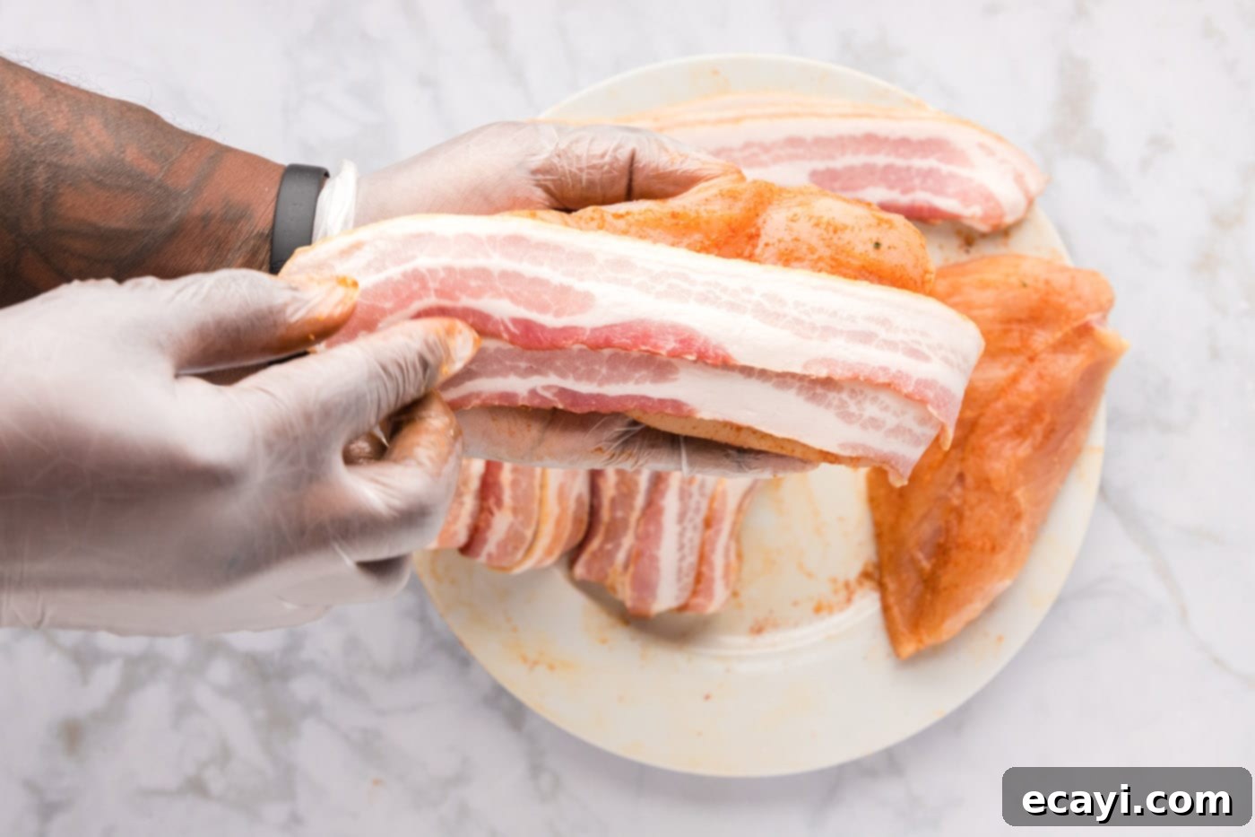 Crispy Bacon-Wrapped Chicken 7 bacon strips on top of seasoned chicken breasts