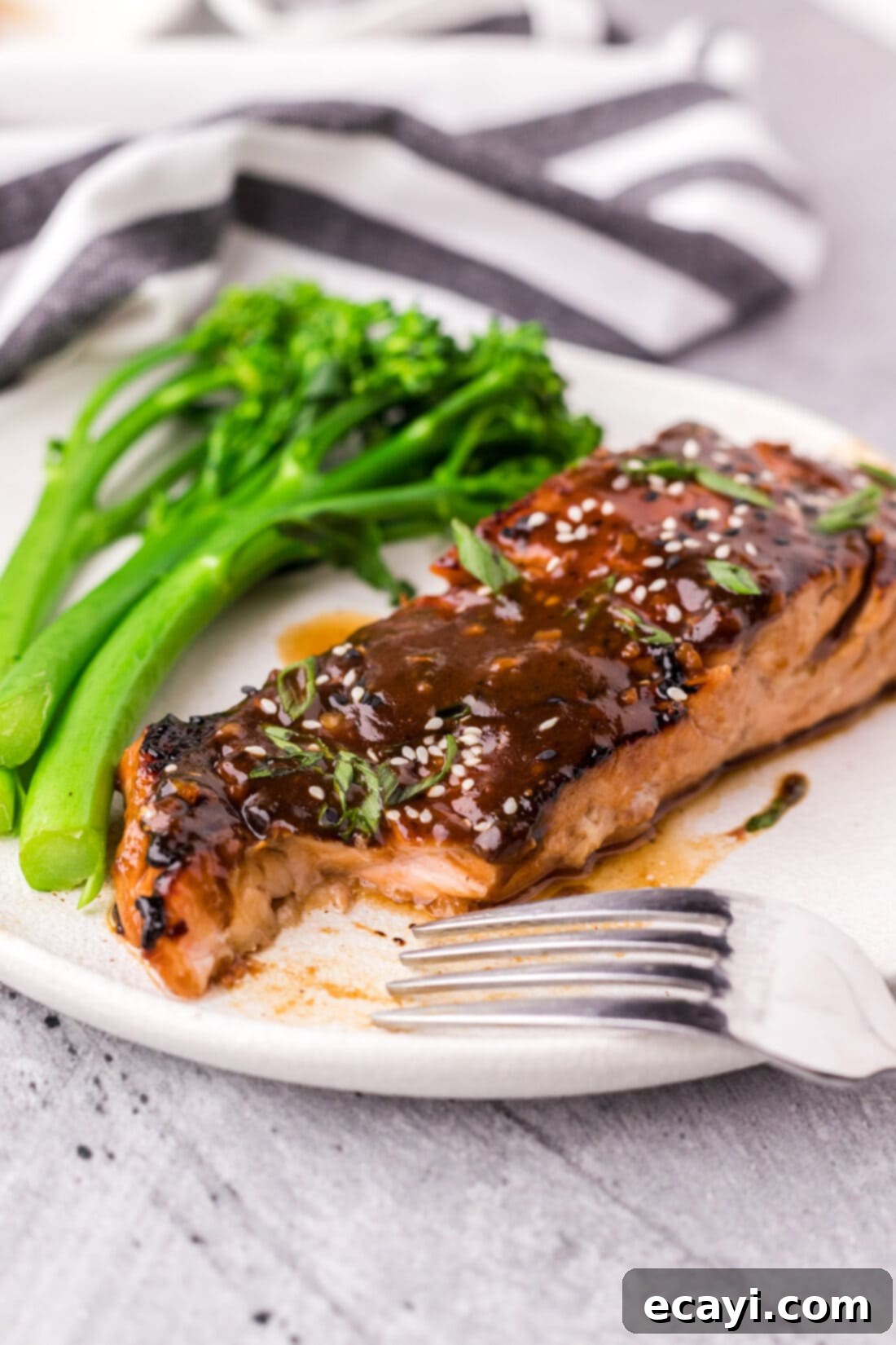 Sweet & Savory Teriyaki Salmon 11 Teriyaki Salmon on a plate with a piece taken out