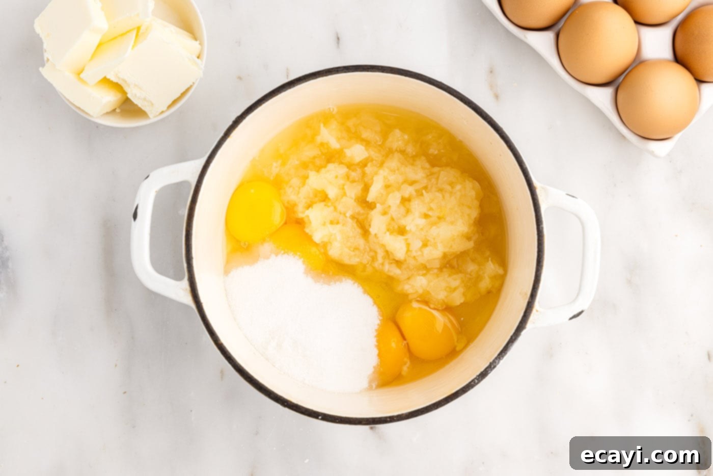 Pineapple Coconut Paradise 13 ingredients for pineapple curd in a sauce pan before cooking