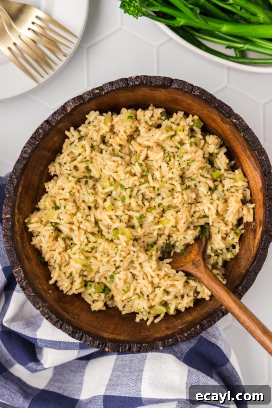Savory Pilaf Perfection 2 Rice Pilaf in a wooden bowl with a wooden spoon