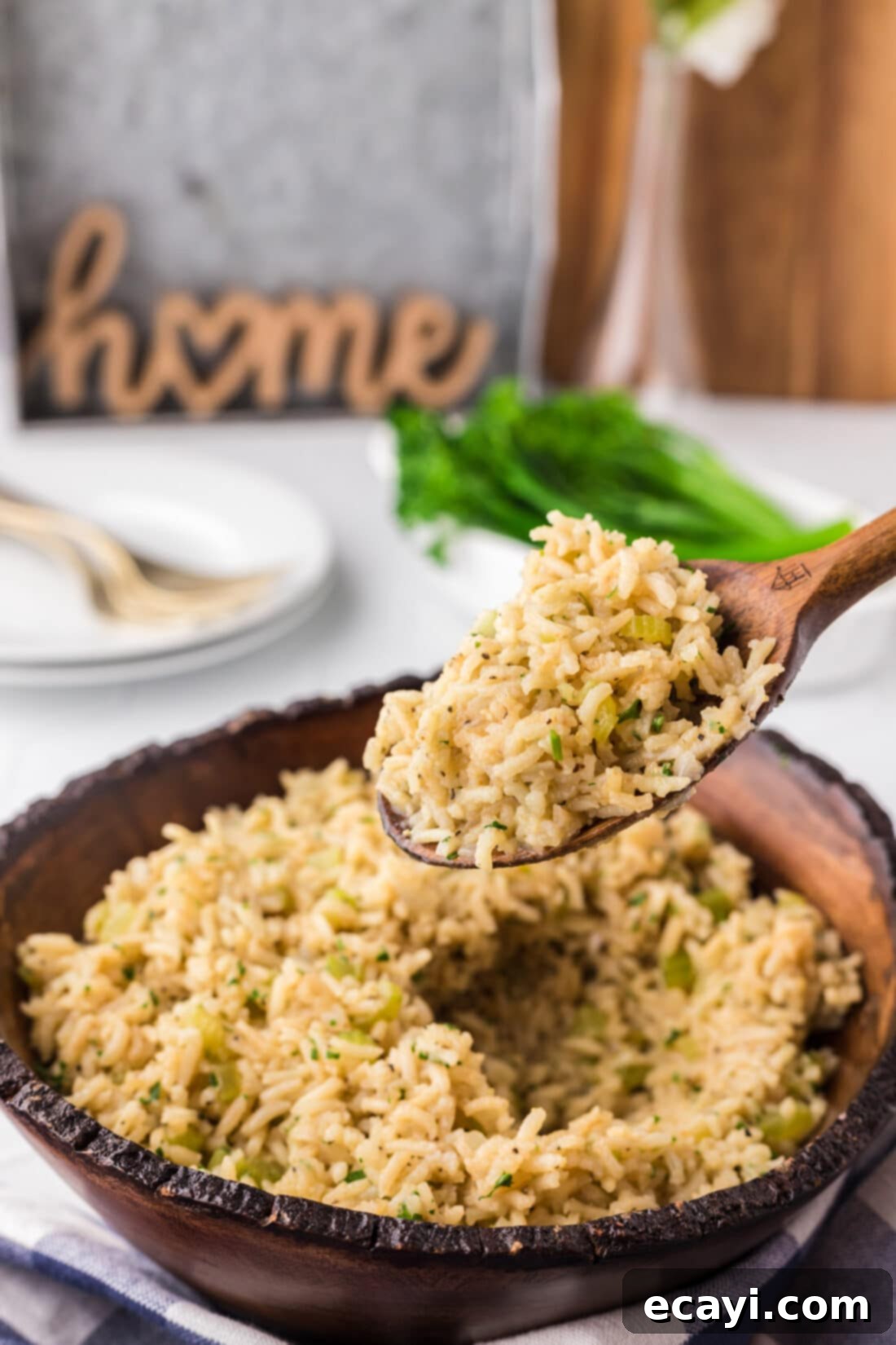 Savory Pilaf Perfection 12 Spoonful of Rice Pilaf being lifted out of a bowl of Rice Pilaf