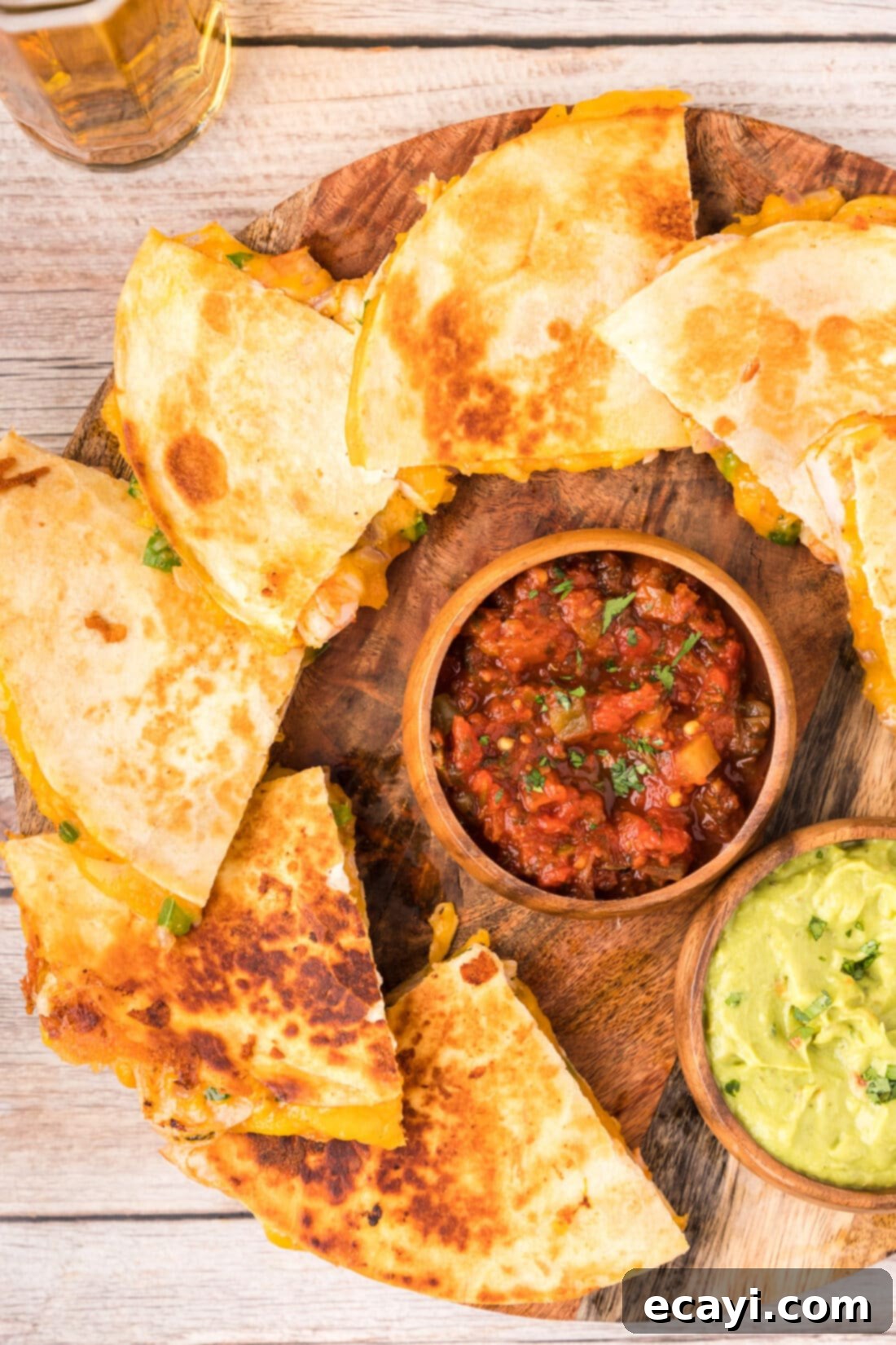 Zesty Shrimp Quesadilla 3 Platter of golden brown Shrimp Quesadillas, ready to serve and enjoy.