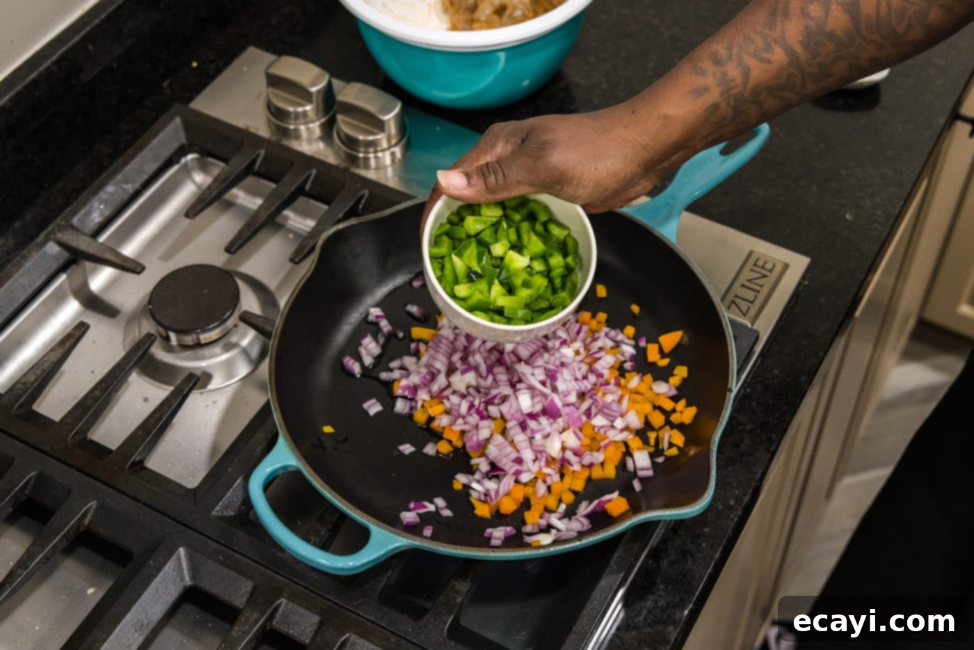 Zesty Shrimp Quesadilla 6 Adding diced green bell pepper to a skillet already containing red onion and orange bell pepper, beginning to sauté the vegetables.