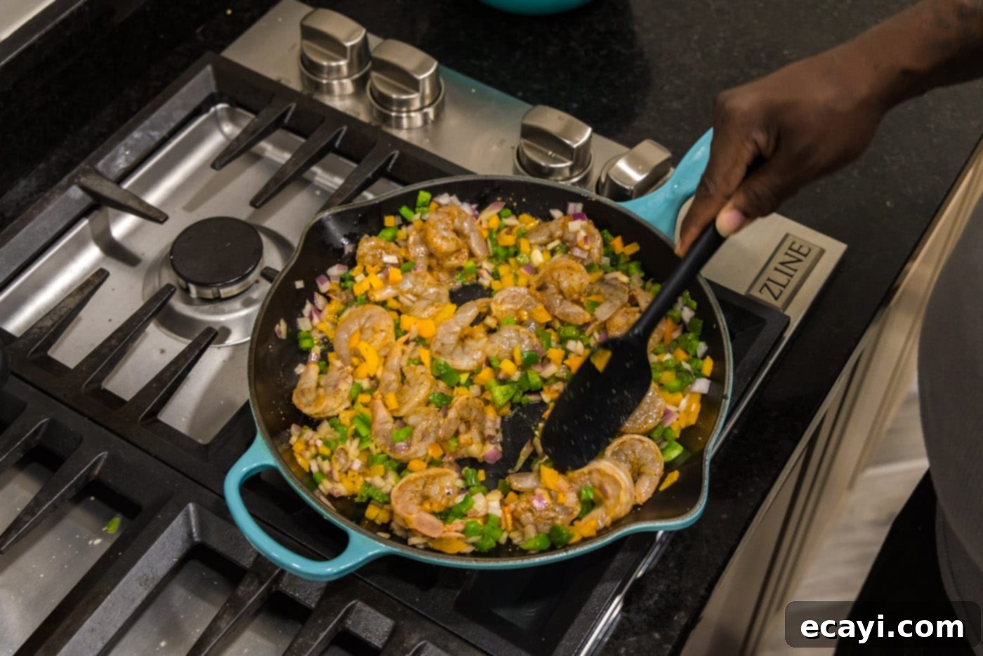 Zesty Shrimp Quesadilla 8 Stirring the shrimp and vegetable mixture in a skillet, ensuring the shrimp cooks evenly.