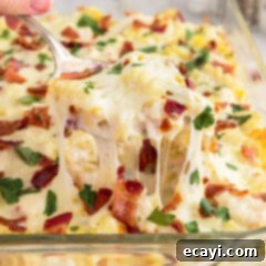 Creamy Chicken Bacon Ranch Bake 15 Spoonful of Chicken Bacon Ranch Casserole being lifted out of a casserole dish