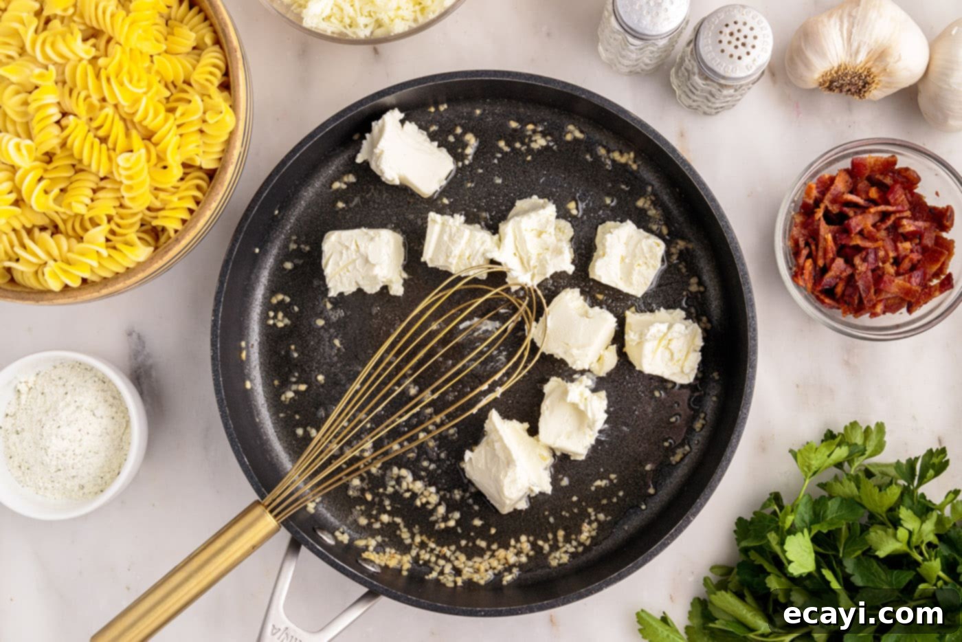 Creamy Chicken Bacon Ranch Bake 6 whisking cream cheese into skillet with garlic