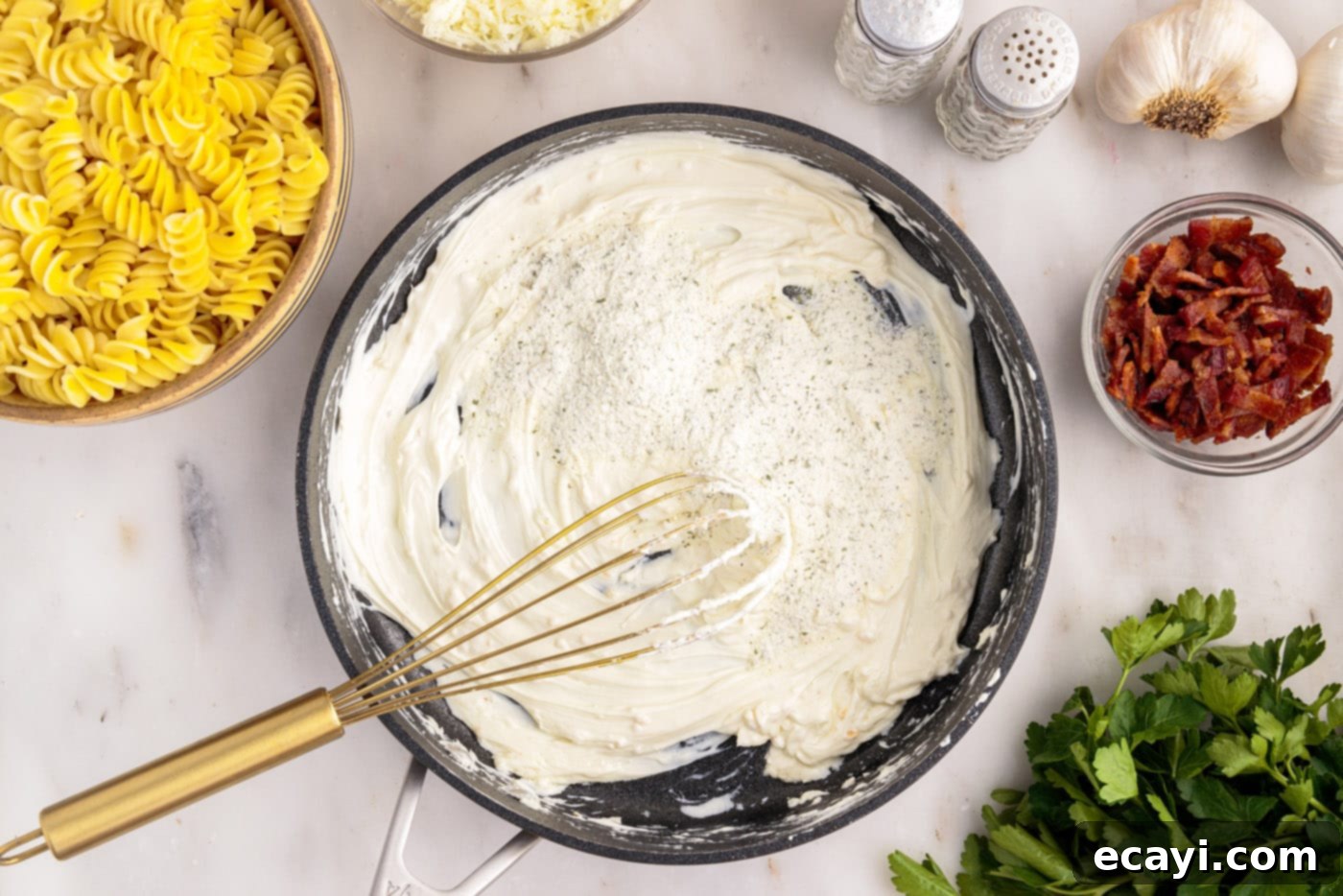 Creamy Chicken Bacon Ranch Bake 7 whisking ranch seasoning mix into cream cheese in a skillet
